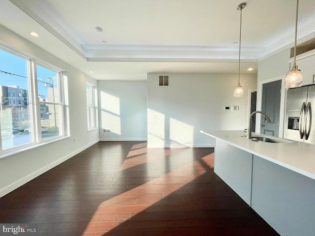 1337 N Franklin St, Philadelphia, PA 19122 - kitchen featuring a sink, stainless steel refrigerator with ice dispenser, dark wood finished floors, decorative light fixtures, and baseboards