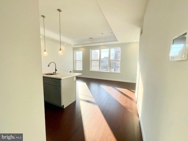 1337 N Franklin St, Philadelphia, PA 19122 - kitchen featuring a sink, dark wood finished floors, a tray ceiling, pendant lighting, and light countertops