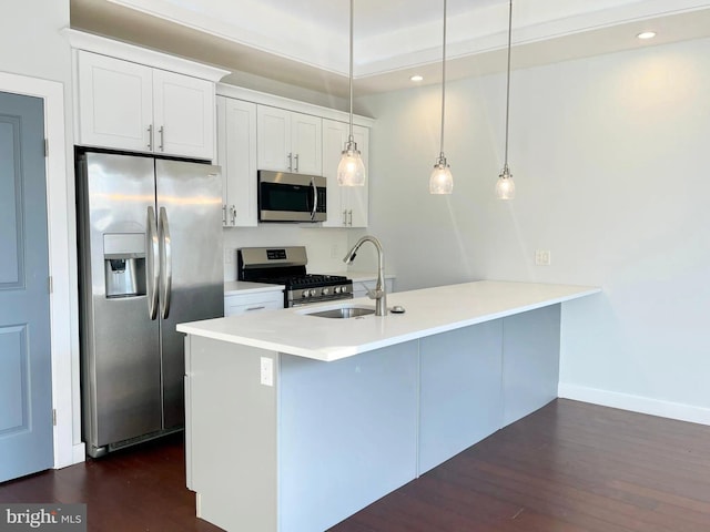 1337 N Franklin St, Philadelphia, PA 19122 - kitchen featuring appliances with stainless steel finishes, a sink, dark wood-type flooring, white cabinetry, and recessed lighting