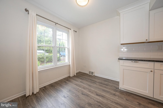 1380 Putnam Blvd Unit 4, Wallingford, PA 19086 - unfurnished dining area with dark wood-type flooring and baseboards