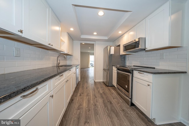 1380 Putnam Blvd Unit 4, Wallingford, PA 19086 - kitchen with stainless steel appliances, a sink, dark wood-style floors, white cabinetry, and recessed lighting