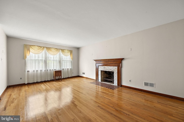 2507 Garth Rd, Wilmington, DE 19810 - unfurnished living room with wood finished floors, a fireplace, and baseboards
