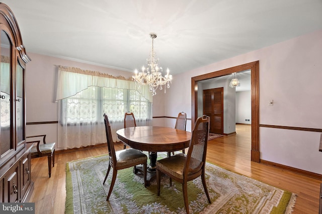 2507 Garth Rd, Wilmington, DE 19810 - dining room featuring light wood-style floors, a chandelier, and baseboards