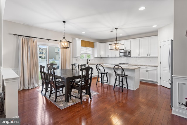 318 Windsor Rd, Mullica Hill, NJ 08062 - dining area with a chandelier, dark wood-type flooring, and recessed lighting
