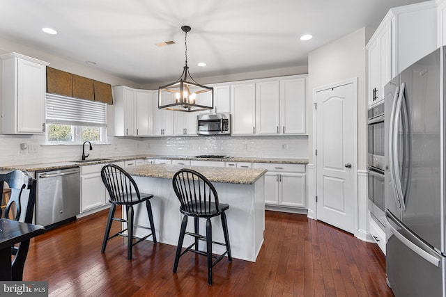 318 Windsor Rd, Mullica Hill, NJ 08062 - kitchen featuring stainless steel appliances, a sink, a chandelier, a center island, and white cabinets