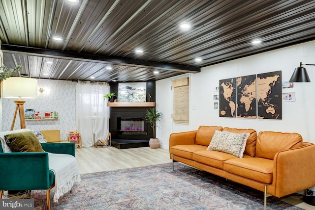 343 N Locust St, Myerstown, PA 17067 - living area featuring wood finished floors, recessed lighting, a glass covered fireplace, wallpapered walls, and beamed ceiling