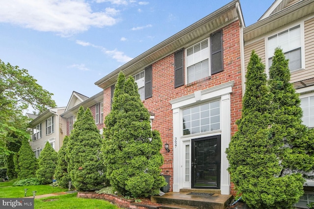3627 Singleton Ter, Frederick, MD 21704 - view of front facade with brick siding and a front lawn