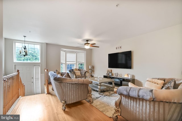 3627 Singleton Ter, Frederick, MD 21704 - living area featuring wood finished floors, a ceiling fan, and a chandelier