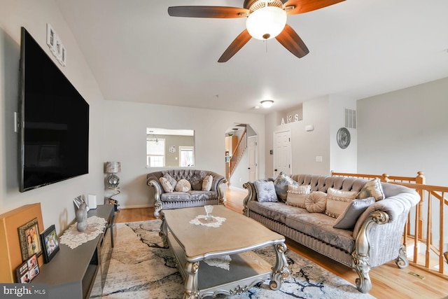 3627 Singleton Ter, Frederick, MD 21704 - living area with wood finished floors, a ceiling fan, and stairway