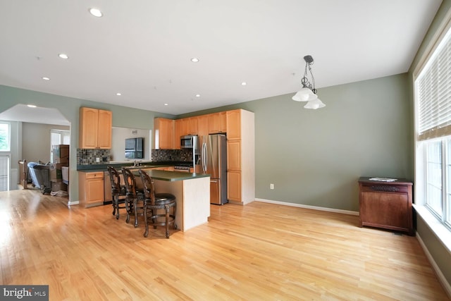 3627 Singleton Ter, Frederick, MD 21704 - kitchen featuring stainless steel appliances, dark countertops, light wood finished floors, and recessed lighting