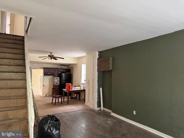 1232 S 11th St, Philadelphia, PA 19147 - living room with stairs, wood finished floors, baseboards, and a ceiling fan