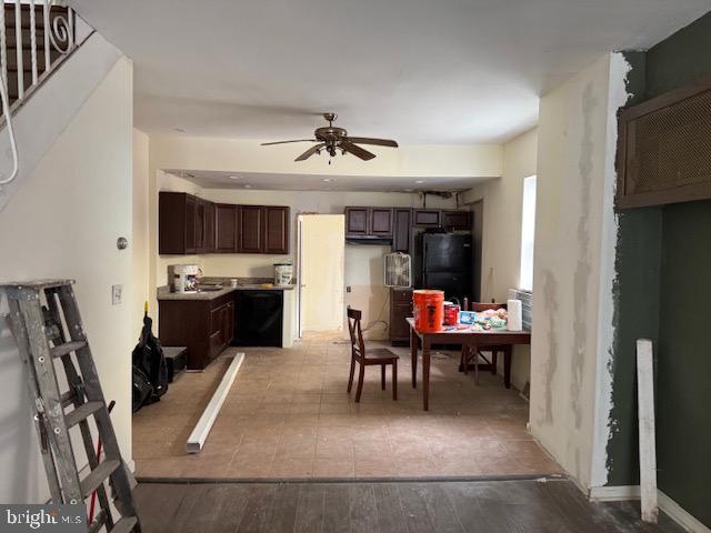 1232 S 11th St, Philadelphia, PA 19147 - kitchen featuring ceiling fan, black appliances, dark brown cabinets, and light wood-style floors