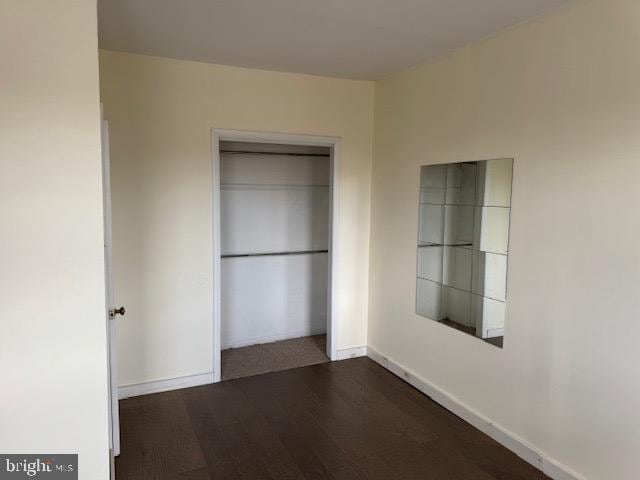 1232 S 11th St, Philadelphia, PA 19147 - unfurnished bedroom featuring baseboards, a closet, and wood finished floors