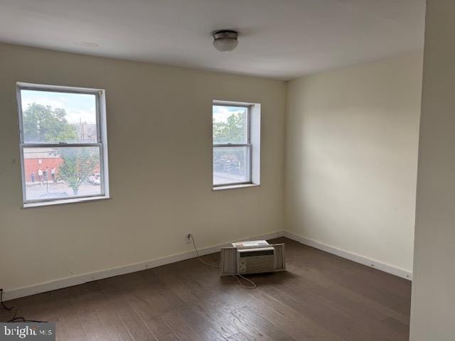1232 S 11th St, Philadelphia, PA 19147 - spare room with wood finished floors, baseboards, and a wall mounted AC