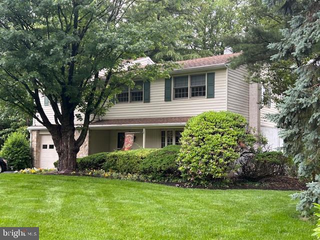 1469 Cathys Ln, North Wales, PA 19454 - view of front of property featuring a front lawn and a garage