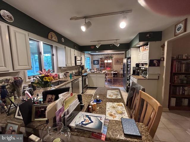 1469 Cathys Ln, North Wales, PA 19454 - dining room with light tile patterned flooring and track lighting