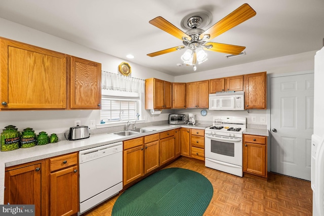 1541 Foresman Dr Unit 125, Pottstown, PA 19464 - kitchen with white appliances, a sink, light countertops, brown cabinets, and recessed lighting
