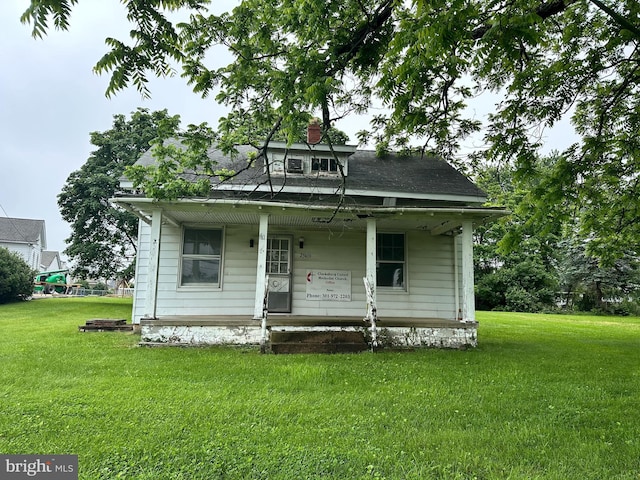 23419 Spire St, Clarksburg, MD 20871 - view of front of home featuring a porch, a front lawn, and a chimney