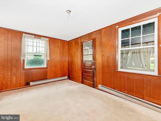 23419 Spire St, Clarksburg, MD 20871 - carpeted spare room with a baseboard heating unit, baseboard heating, and wooden walls