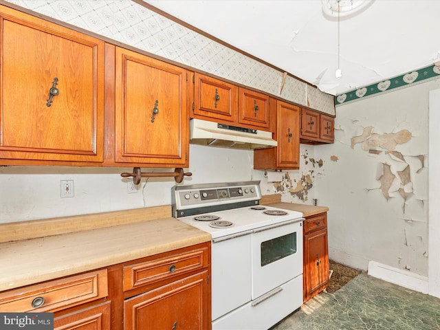 23419 Spire St, Clarksburg, MD 20871 - kitchen with white electric range oven, under cabinet range hood, brown cabinets, light countertops, and wallpapered walls