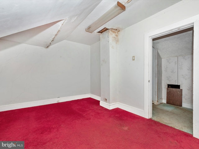 23419 Spire St, Clarksburg, MD 20871 - bonus room with carpet flooring, lofted ceiling, a fireplace, and baseboards