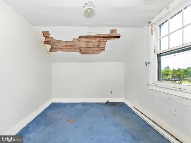 23419 Spire St, Clarksburg, MD 20871 - empty room featuring a baseboard radiator, baseboards, carpet floors, and vaulted ceiling
