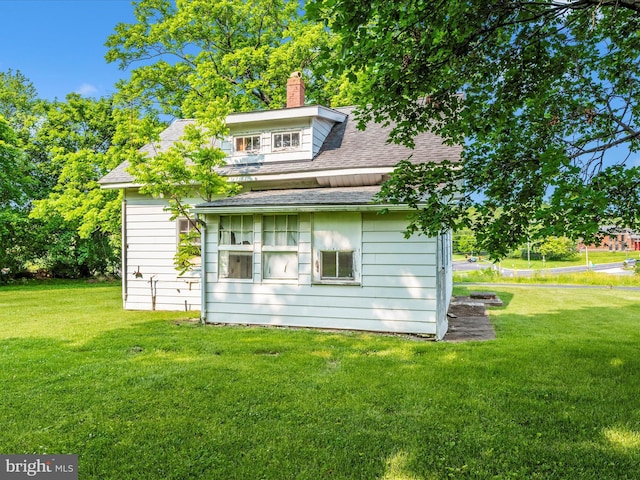 23419 Spire St, Clarksburg, MD 20871 - rear view of house featuring a shingled roof, a lawn, and a chimney
