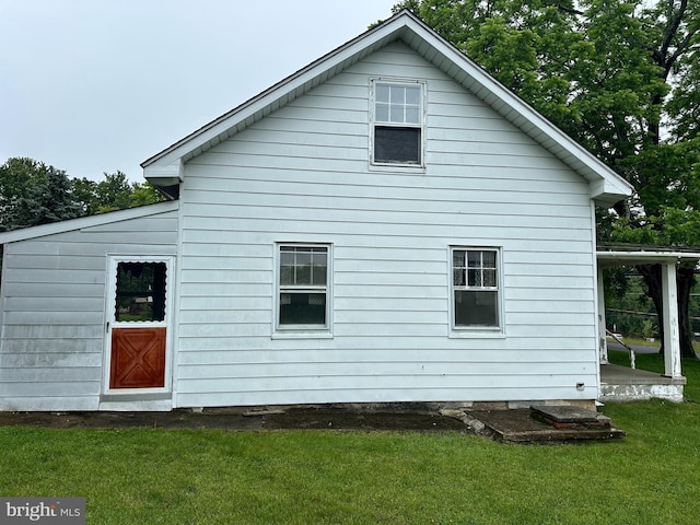 23419 Spire St, Clarksburg, MD 20871 - rear view of property featuring a lawn