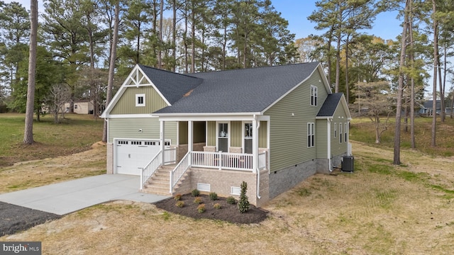 6978 Bray Rd, Hayes, VA 23072 - craftsman house with a porch, driveway, crawl space, a shingled roof, and central air condition unit