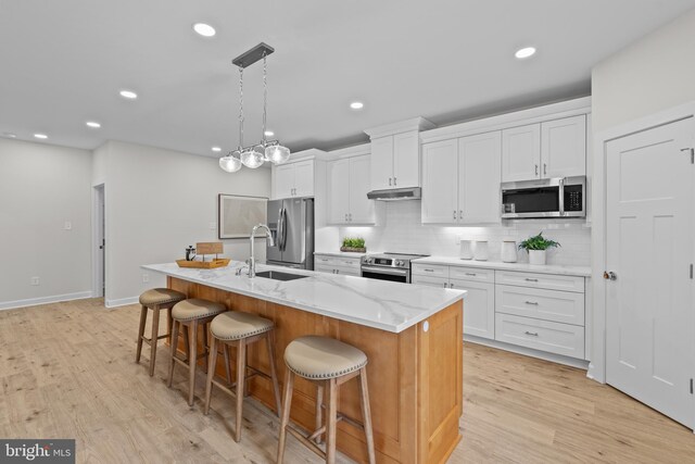 6978 Bray Rd, Hayes, VA 23072 - kitchen featuring appliances with stainless steel finishes, a sink, white cabinetry, and recessed lighting