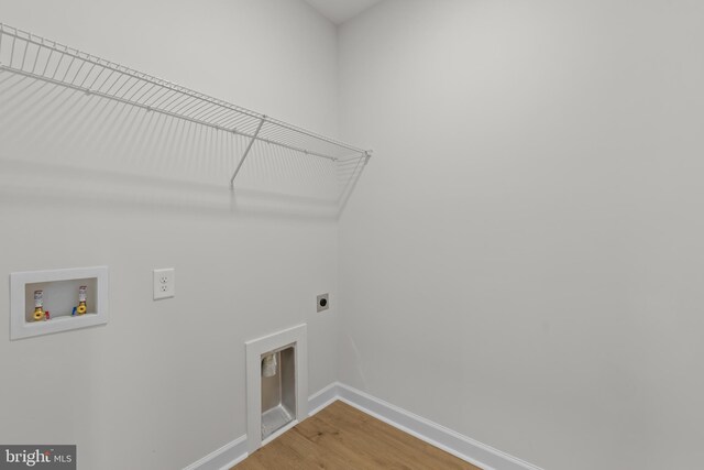 6978 Bray Rd, Hayes, VA 23072 - laundry area with electric dryer hookup, washer hookup, baseboards, and light wood finished floors