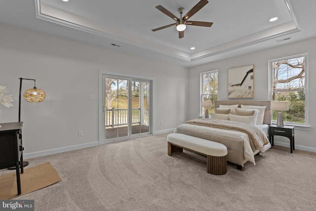 6978 Bray Rd, Hayes, VA 23072 - bedroom featuring a tray ceiling, access to exterior, baseboards, multiple windows, and recessed lighting