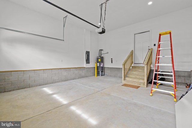 6978 Bray Rd, Hayes, VA 23072 - garage with water heater, electric panel, a garage door opener, and recessed lighting