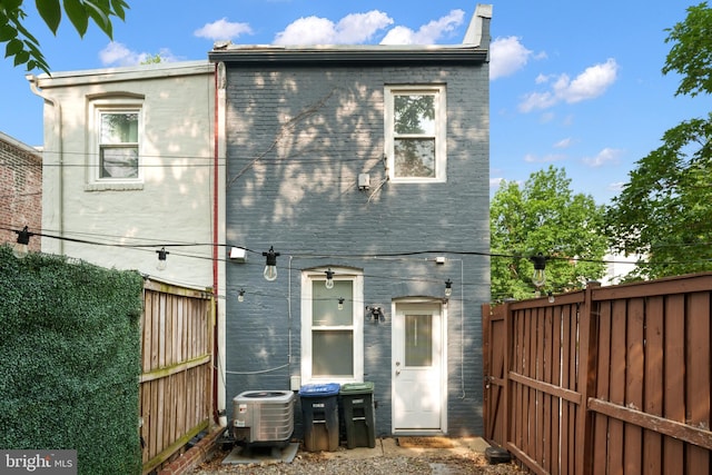 1615 5th St NW, Washington, DC 20001 - rear view of house with central air condition unit and a fenced backyard
