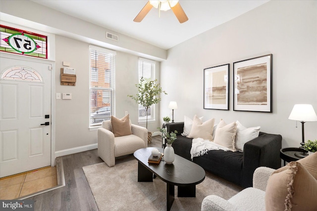 57 E Heath St, Baltimore, MD 21230 - living room featuring wood finished floors, a ceiling fan, and baseboards