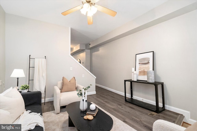 57 E Heath St, Baltimore, MD 21230 - living room featuring wood finished floors, stairs, baseboards, and a ceiling fan