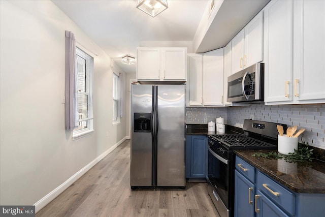 57 E Heath St, Baltimore, MD 21230 - kitchen featuring stainless steel appliances, blue cabinets, baseboards, and white cabinets