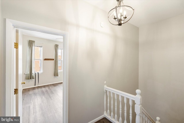57 E Heath St, Baltimore, MD 21230 - corridor featuring an upstairs landing, baseboards, wood finished floors, and a chandelier