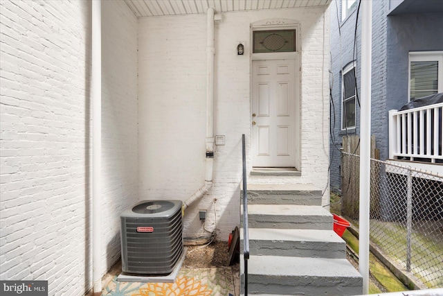 57 E Heath St, Baltimore, MD 21230 - view of exterior entry with central AC unit and brick siding
