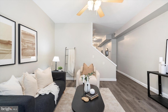 57 E Heath St, Baltimore, MD 21230 - living area with wood finished floors, ceiling fan, baseboards, and stairway