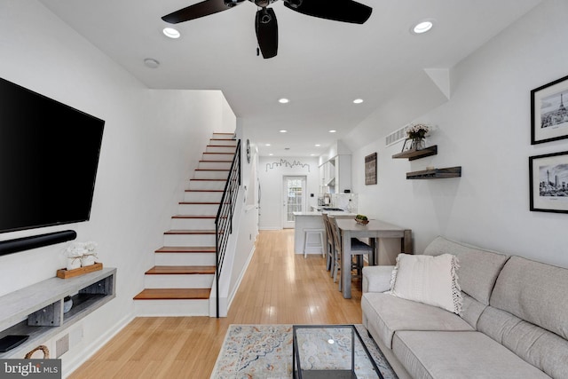 1903 Webster St, Philadelphia, PA 19146 - living room with stairs, ceiling fan, light wood-style floors, recessed lighting, and baseboards