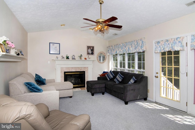 55 Glen Burnie Dr, Sicklerville, NJ 08081 - living area featuring a ceiling fan, a textured ceiling, vaulted ceiling, carpet flooring, and a high end fireplace