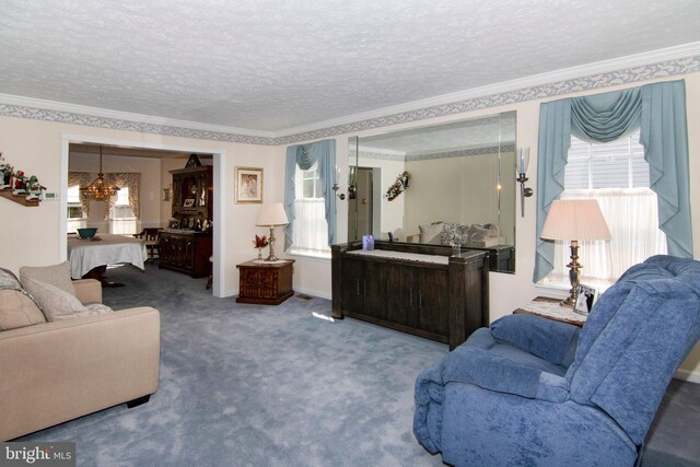 55 Glen Burnie Dr, Sicklerville, NJ 08081 - carpeted living area with ornamental molding, a chandelier, and a textured ceiling