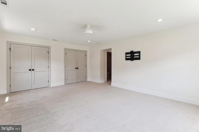 5214 Juliet St, Springfield, VA 22151 - unfurnished bedroom featuring light colored carpet, recessed lighting, and multiple closets