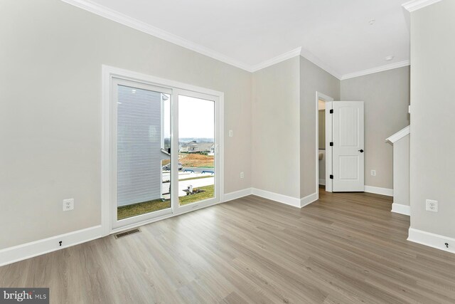 509 Abigail Ave, Waynesboro, PA 17268 - empty room featuring wood finished floors, baseboards, and ornamental molding