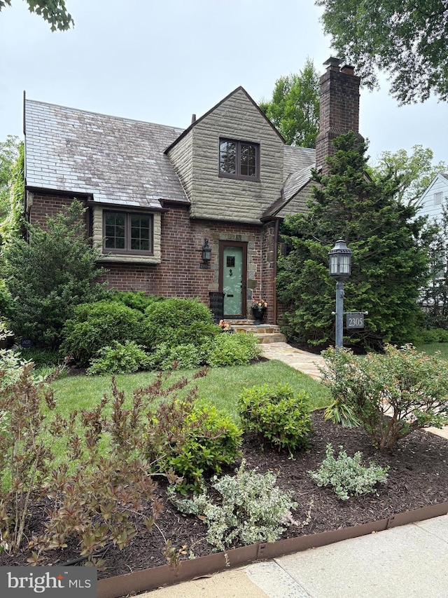 2305 S Inge St S, Arlington, VA 22202 - view of front of property with a high end roof, a chimney, and brick siding