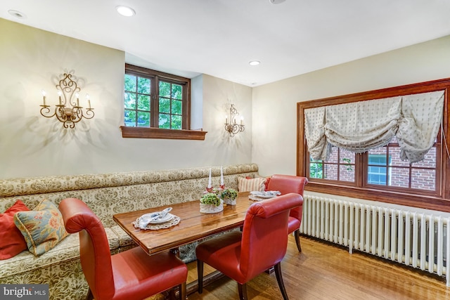 2305 S Inge St S, Arlington, VA 22202 - dining room with radiator, wood finished floors, and recessed lighting