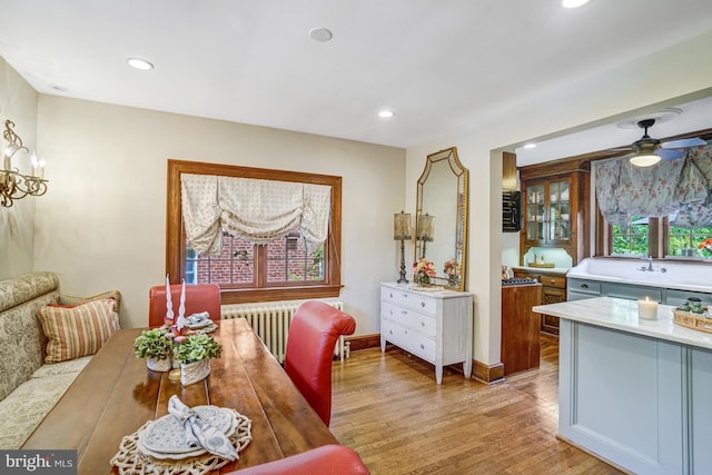2305 S Inge St S, Arlington, VA 22202 - dining area featuring light wood-type flooring, radiator, ceiling fan, recessed lighting, and baseboards