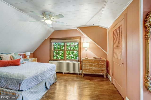 2305 S Inge St S, Arlington, VA 22202 - bedroom featuring radiator, vaulted ceiling, wood finished floors, ceiling fan, and a closet