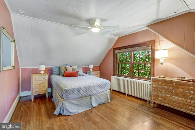 2305 S Inge St S, Arlington, VA 22202 - bedroom with radiator, hardwood / wood-style flooring, vaulted ceiling, ceiling fan, and baseboards